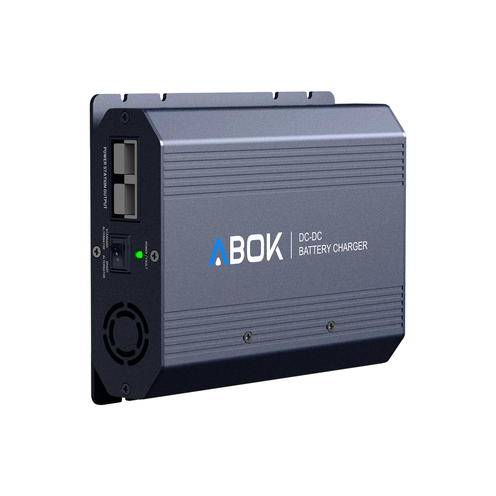 ABOK ACS500 DC-DC battery charger in an angled view showing the output ports, selector switch, LED, and cooling fan.